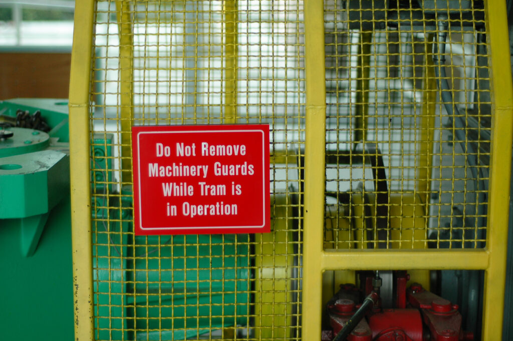 Alt text: Machine guarding prevents accidents and injuries on the factory floor.